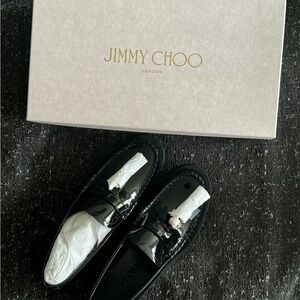 Jimmy Choo Addie Loafer. Black Patent Leather Flat Loafers with Pearl Tassel